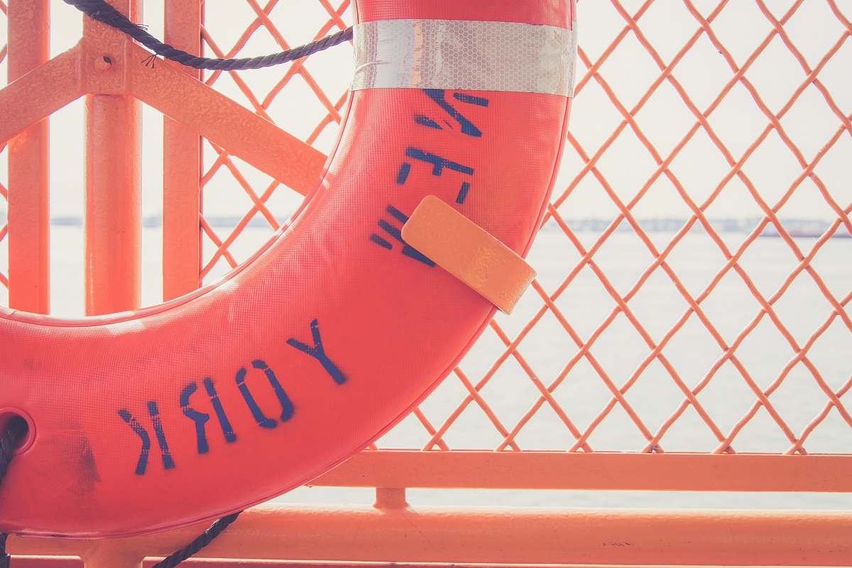 united states red inflatable floater ring on orange metal rack ring